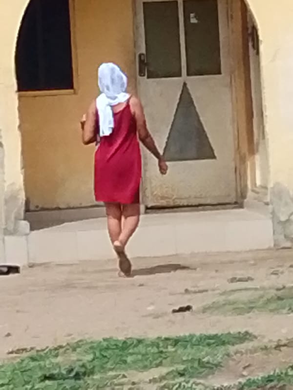 Daily life unfolds on Lokoja streets during afternoon hours