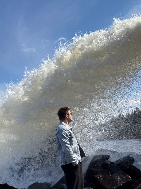 Young man photographed at waterfall in Chernushka, Russia