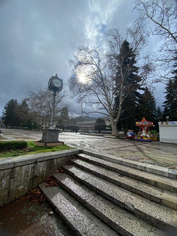 Light snow falls on public square in Troyan, Bulgaria