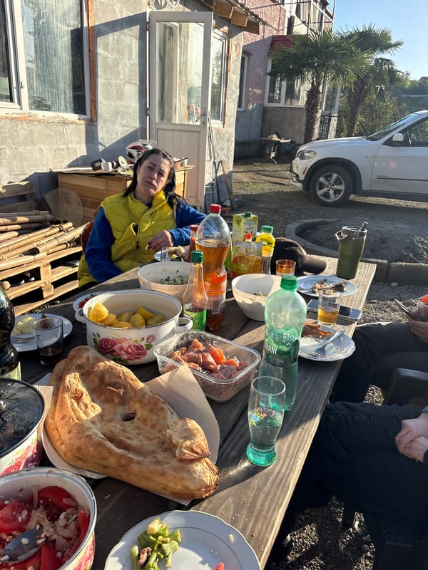 Outdoor feast documented at picnic table in Chakvi, Georgia