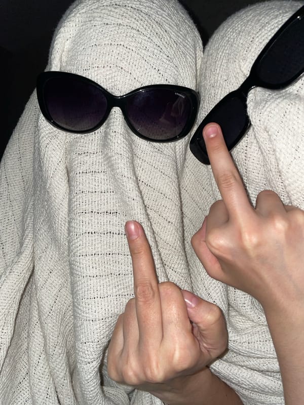 Two women share quiet evening moments in Izhevsk bedroom