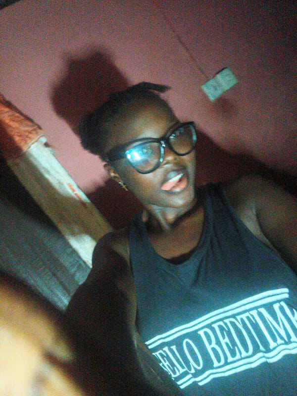 Young woman documents evening selfie session in Onitsha, Nigeria