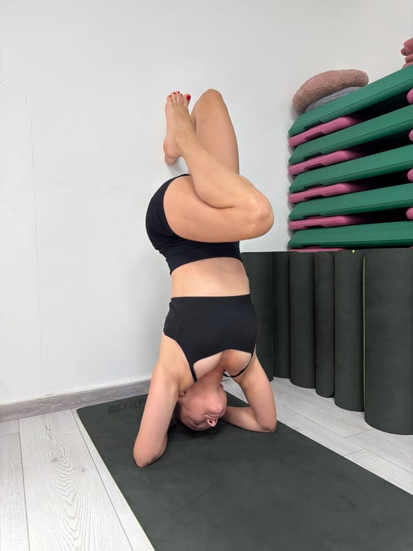 Woman practices morning yoga routine in Budva indoor space