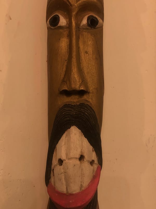 Traditional masks and neon signs captured in Kabalana, Sri Lanka