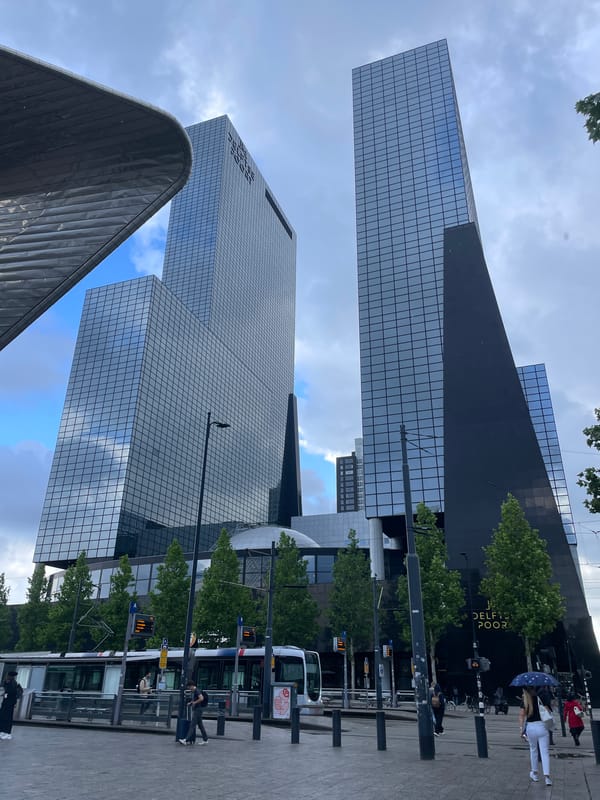 Morning urban documentation captures Rotterdam's modern architecture and streetlife