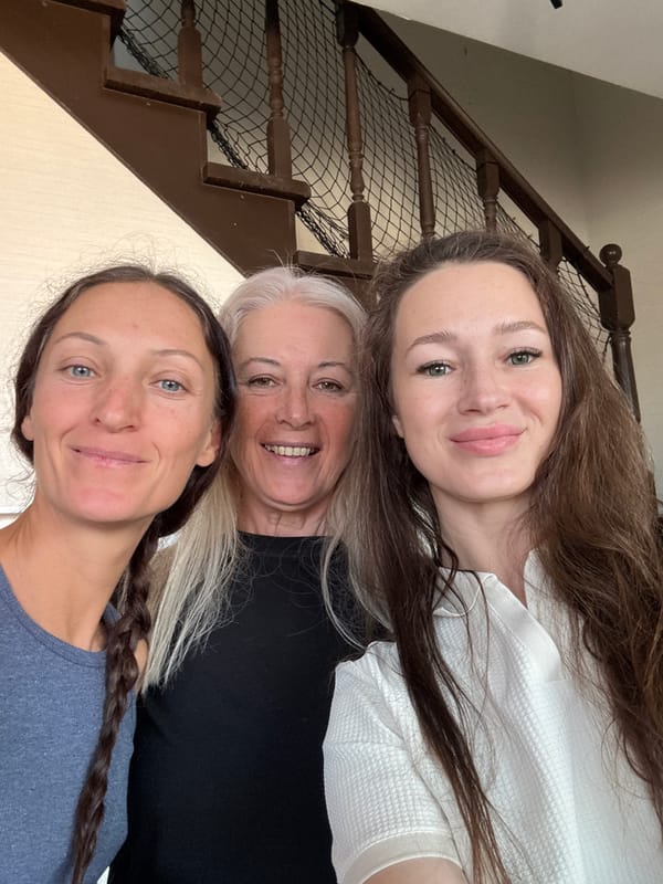 Three women pose for smiling portrait in Ulyanovsk