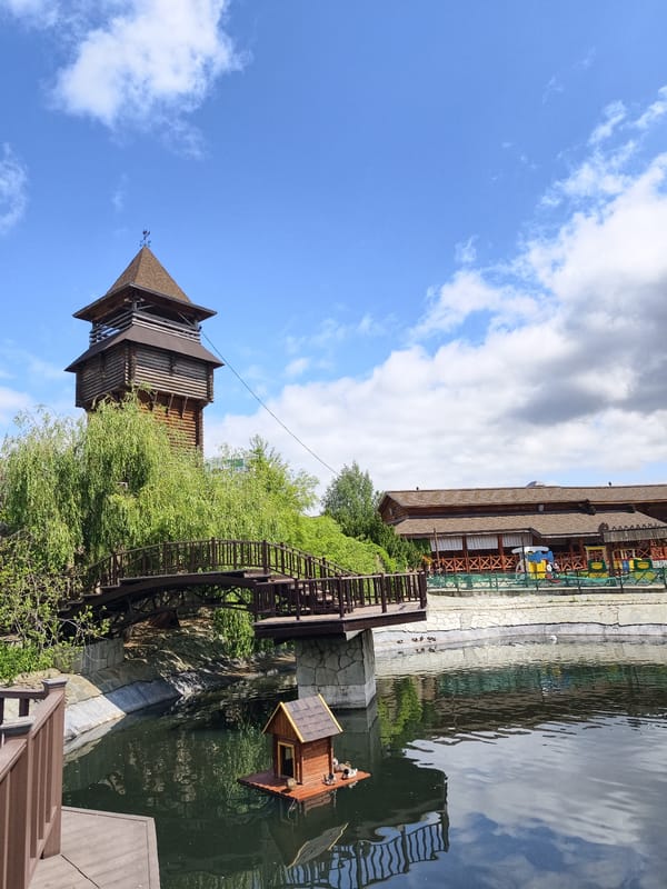 Family visits zoo in Izhevsk on sunny morning