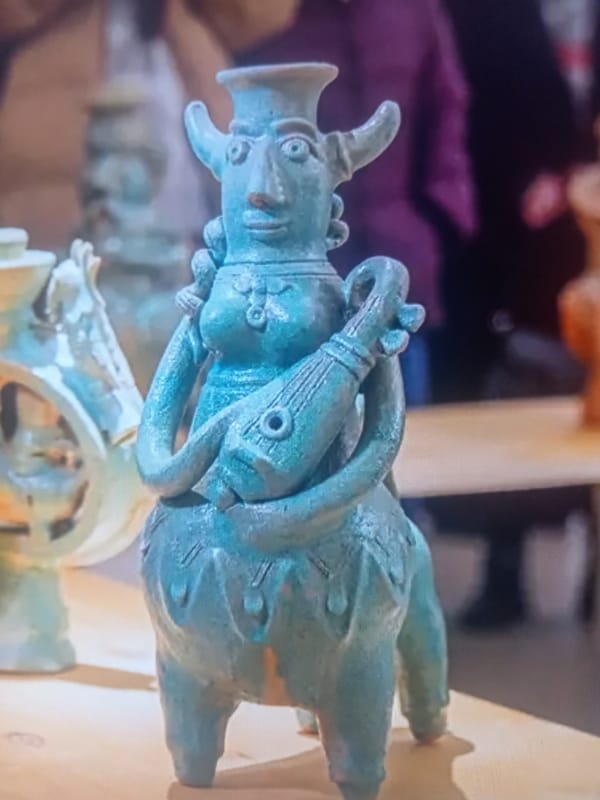 Art gallery visit mixing contemporary paintings and ancient ceramic artifacts