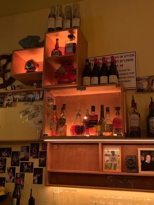 Evening urban life captured across Tel-Aviv dining and art spaces