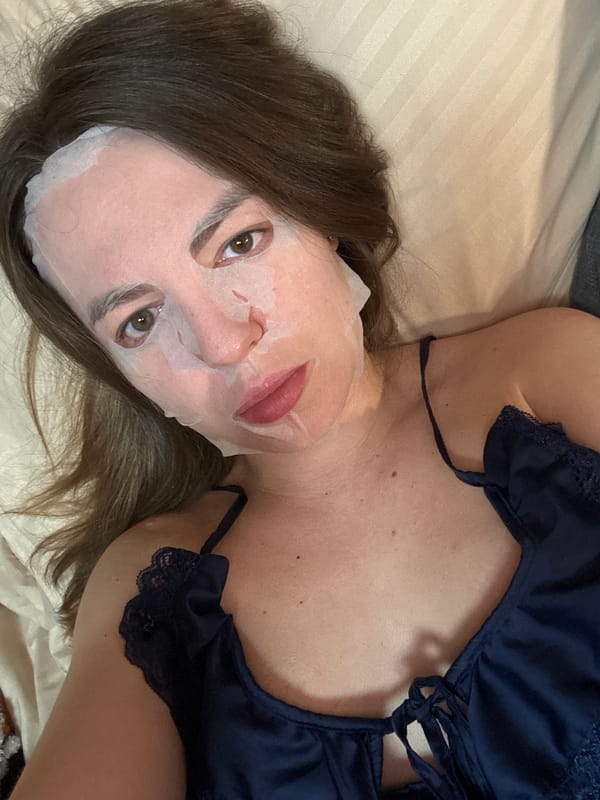 Woman does evening skincare routine in Stary Oskol bedroom