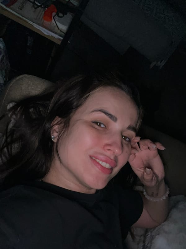 Woman captured in playful bedroom moments during afternoon