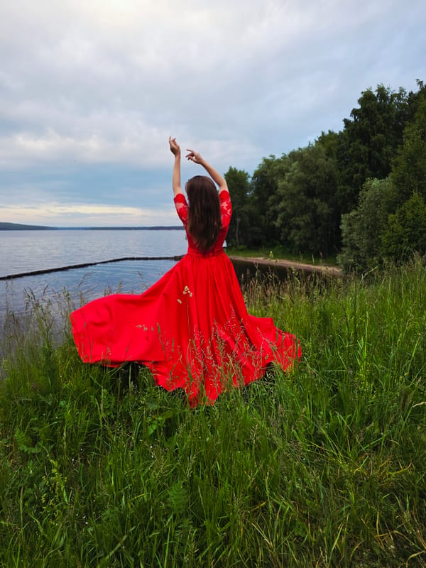 Woman with peonies explores Chaikovsky, Russia during afternoon outing