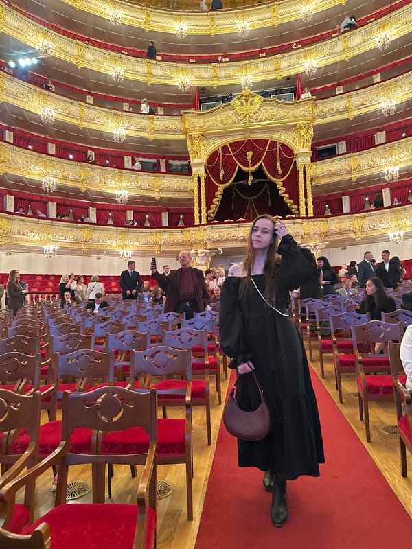 Moscow theater interior captured showing ornate red-gold balcony design