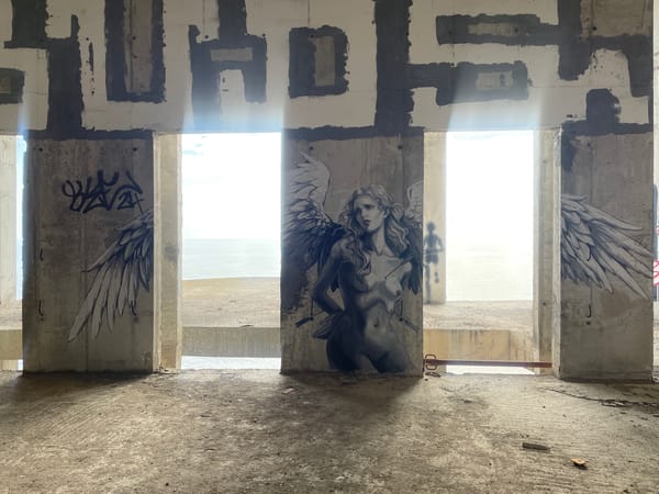 Street art documented in abandoned concrete structure, Montenegro