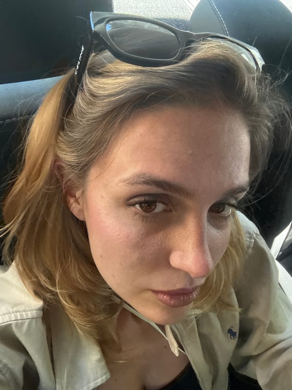 Back-seat portraits moving through Tbilisi on a July afternoon
