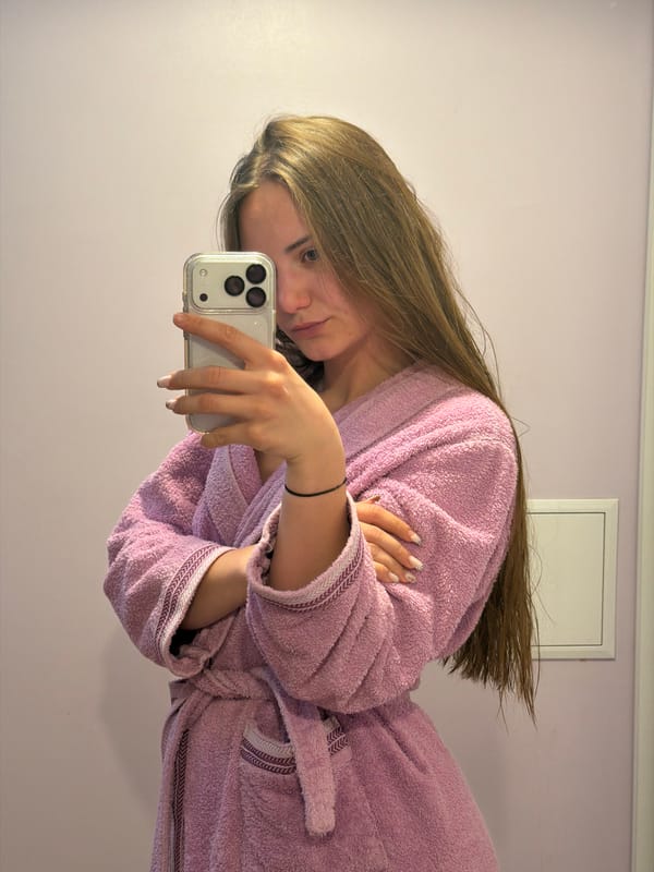 Woman takes relaxed mirror selfie in Buhovo, Bulgaria
