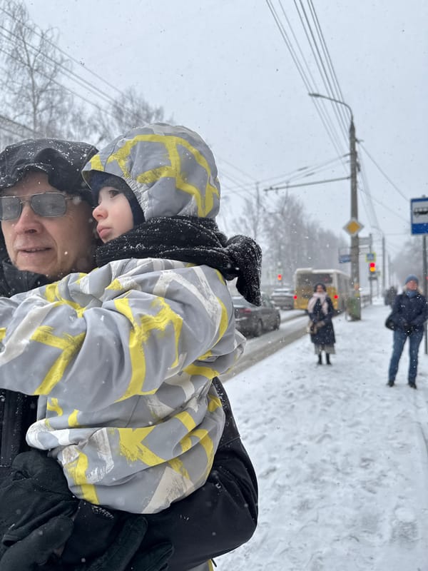 Three people gather in snowy Izhevsk Friday morning