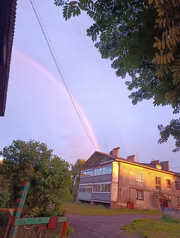Sunset and rainbow over rural Zolotets, Russia