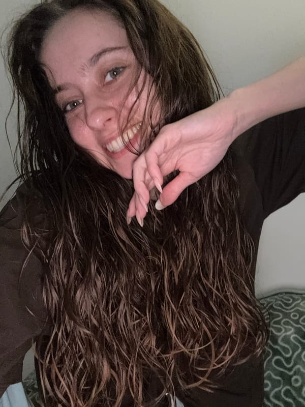 Woman poses smiling for camera in Ramat Gan