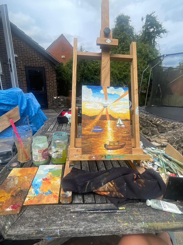 Artist paints seascape outdoors in Maidstone garden setting