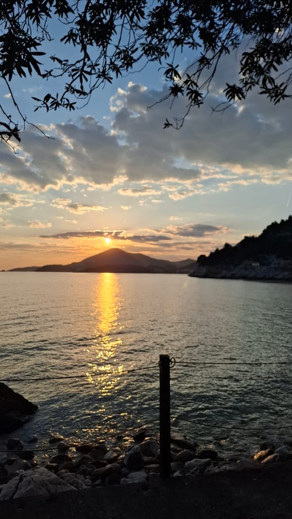 Evening stroll documented along Montenegro coastline during golden hour