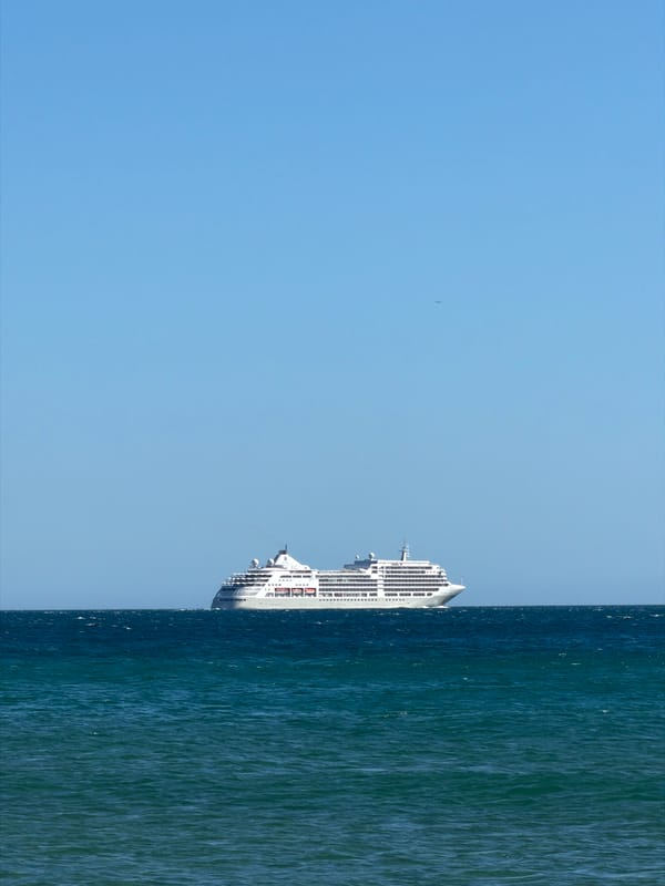 Cruise ship anchors off Cascais beach draws beachgoers' attention