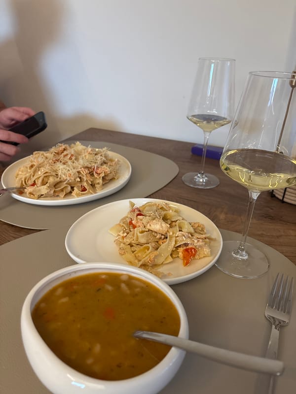 Creamy salmon fettuccine dinner on a wooden table in Viernheim