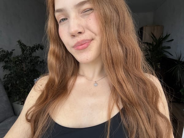 Young Woman Takes Selfies, Photographs Orchids in Russian Home