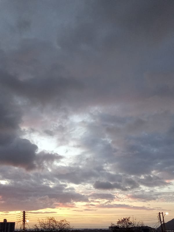 Young man plays drums, handles equipment in Juan Griego yard