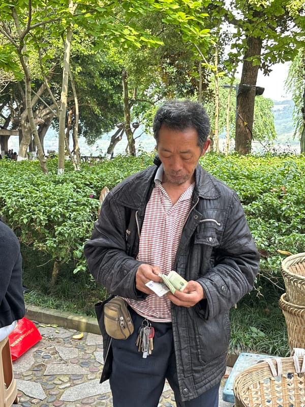 Elderly men gather along Yangtze River waterfront in Jiangjin