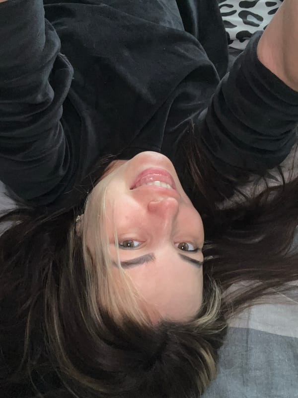 Woman captures series of selfies in bedroom setting