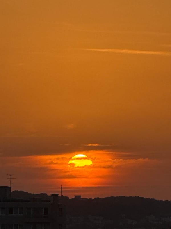 City sunset with contrails and orange skies, multiple angles