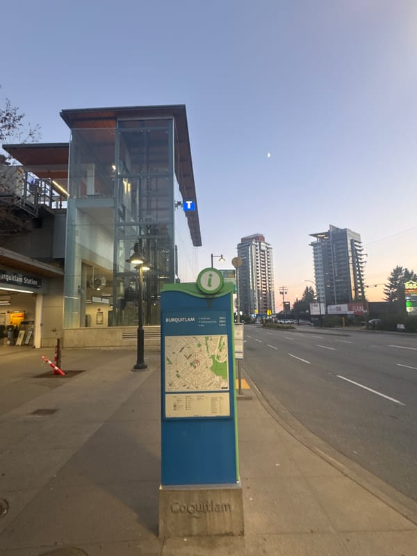 Burquitlam Station area at dusk, transit and towers.
