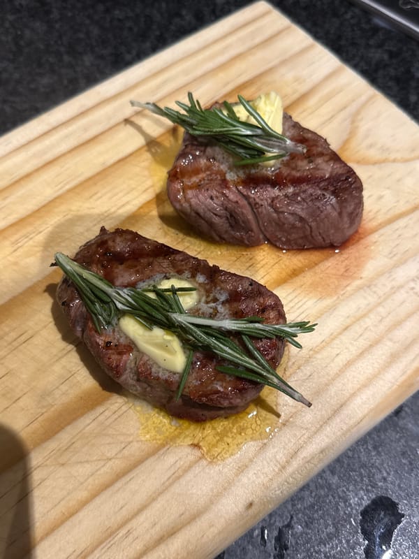 Cape Town resident grills steak dinner with corn, mushrooms