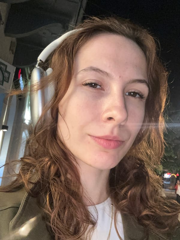 Woman takes selfie near Serbian National Theatre in Novi Sad