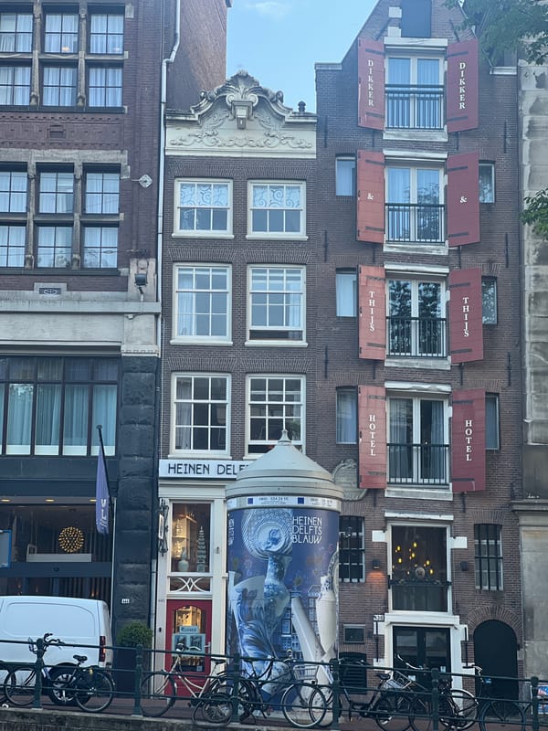 Casual canal-side hangout spot, Amsterdam, littered waterfront