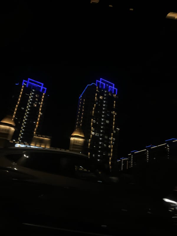 Nighttime view of illuminated buildings captured in Krasnodar