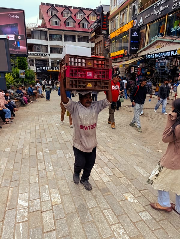 Morning commerce captured in Manali's bustling streets and workshops