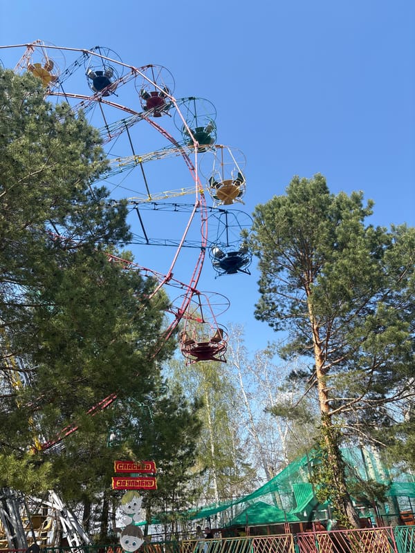 Amusement park attractions and visitor documented at unknown location