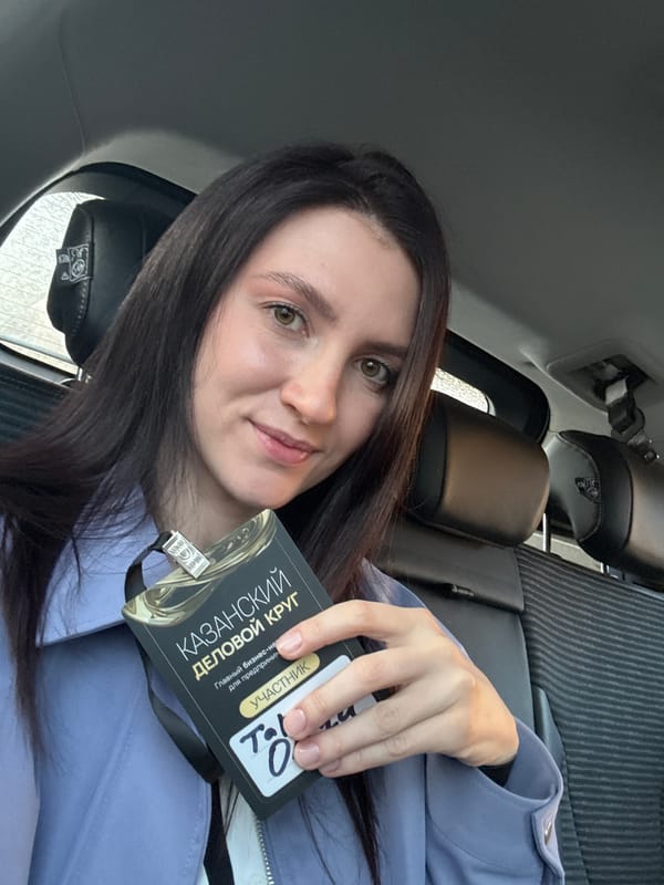 Woman takes selfie in car backseat in Kazan