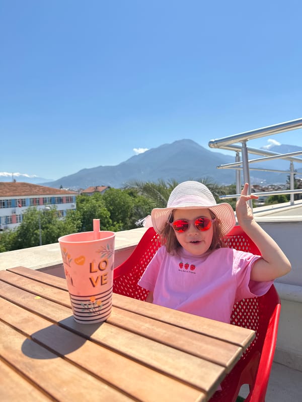Woman with baby prepares coffee, travels elevator in Fethiye