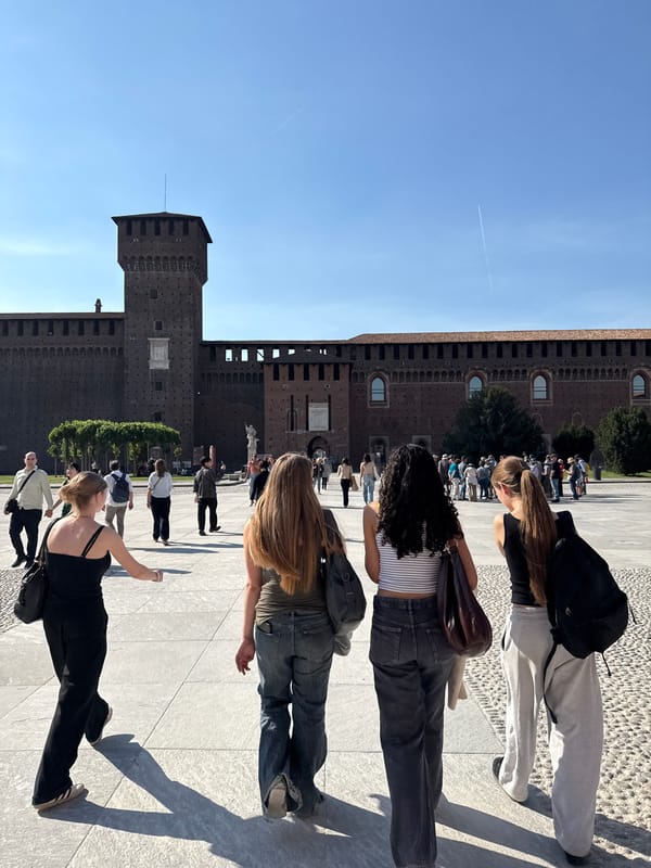 Tourist documents sunny afternoon visit to Milan's Sforza Castle