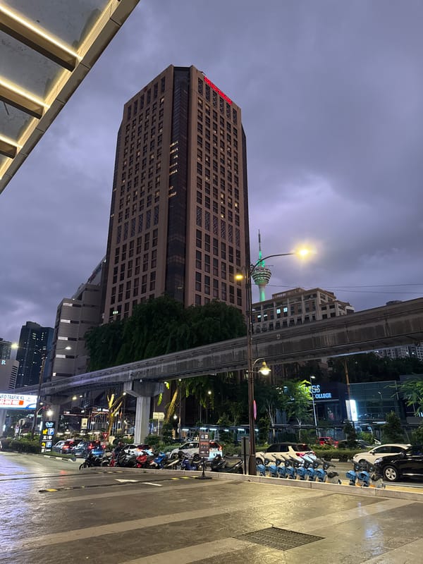 Street-level and skyline views across central Kuala Lumpur