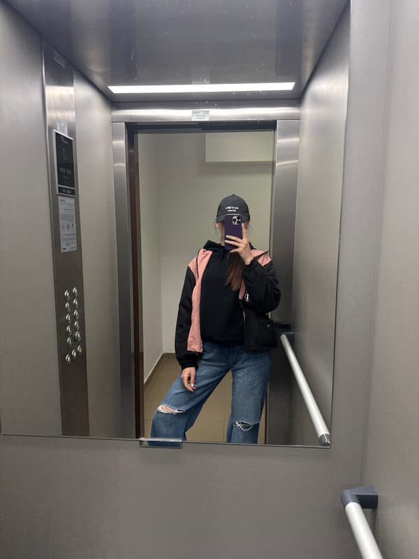 Person documented in elevator and building exterior in Plovdiv