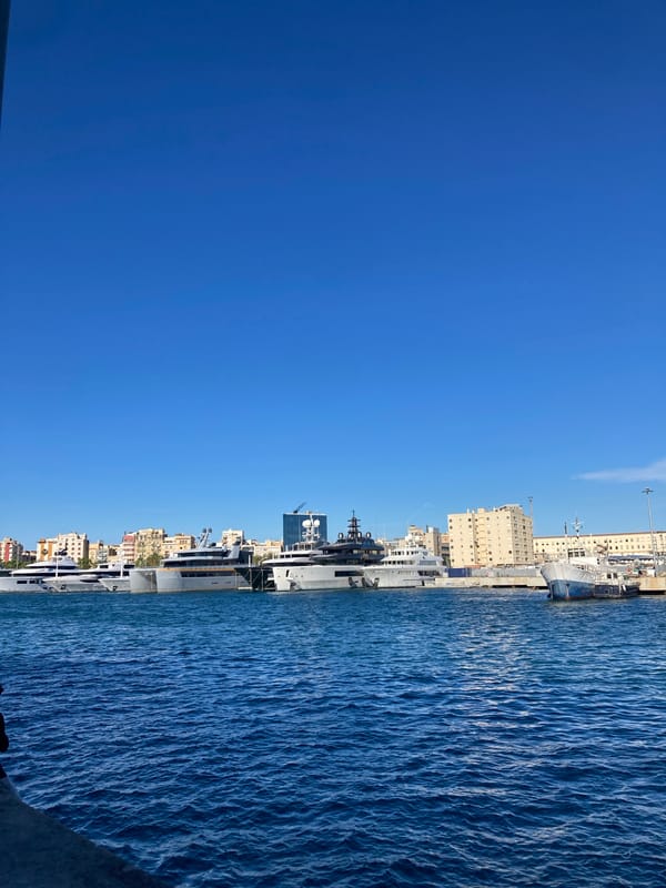 Clear harbor scene with docked ships observed