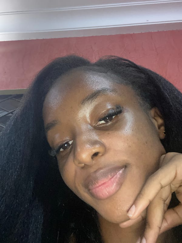 Woman takes selfie portraits indoors in Jos, Nigeria