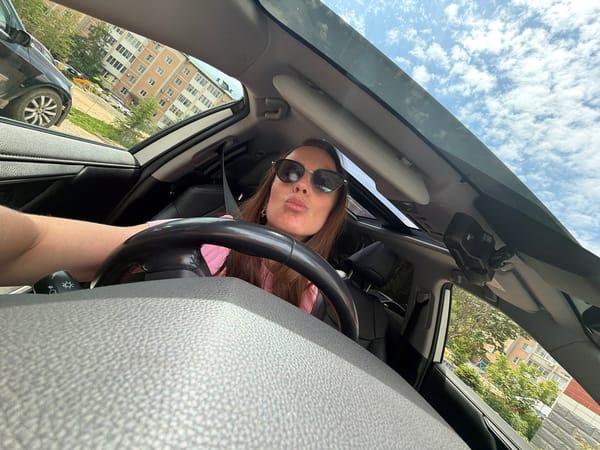 Woman takes selfies with car in Birobidzhan, Russia