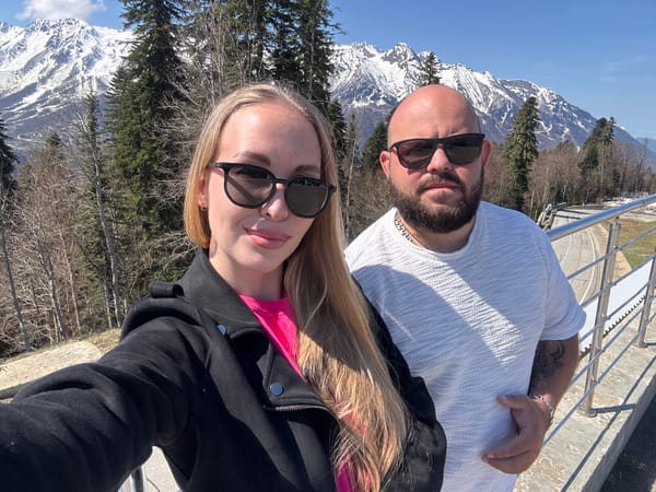 Couple documents scenic mountain drive in Estosadok resort area