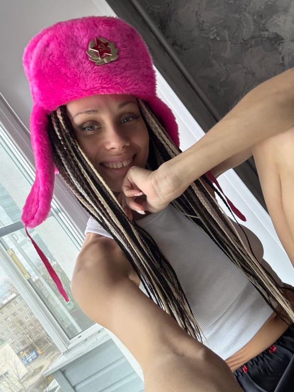 Woman in Soviet ushanka takes selfie in Yaroslavl