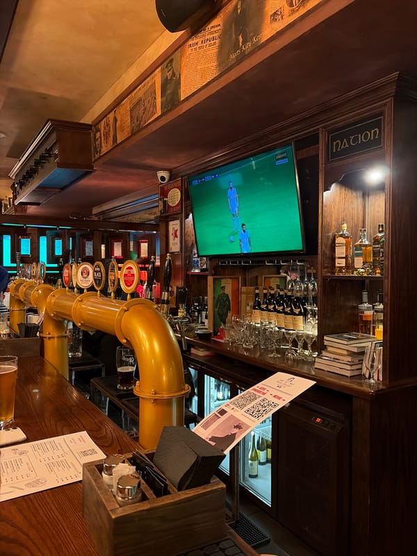 Evening at a Moscow Irish pub, beer taps and all